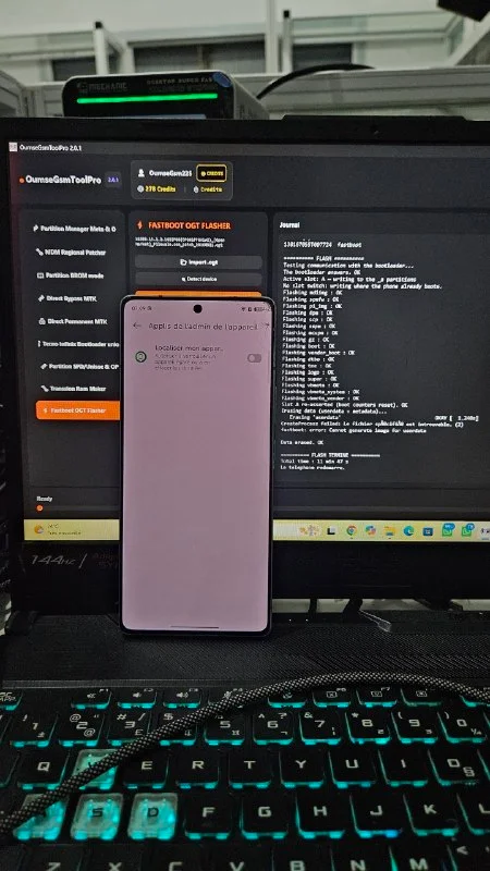OumseGsmToolPro working on a device